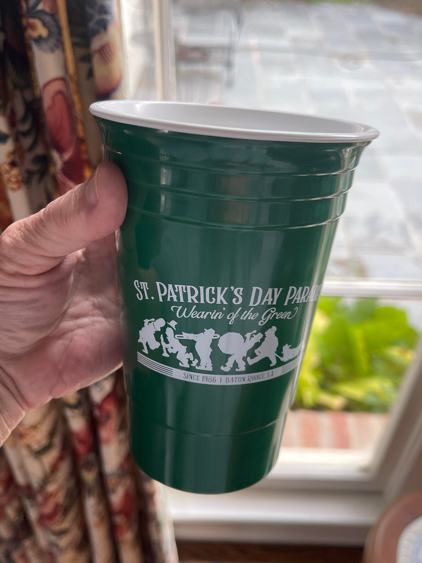 Single cup being held.