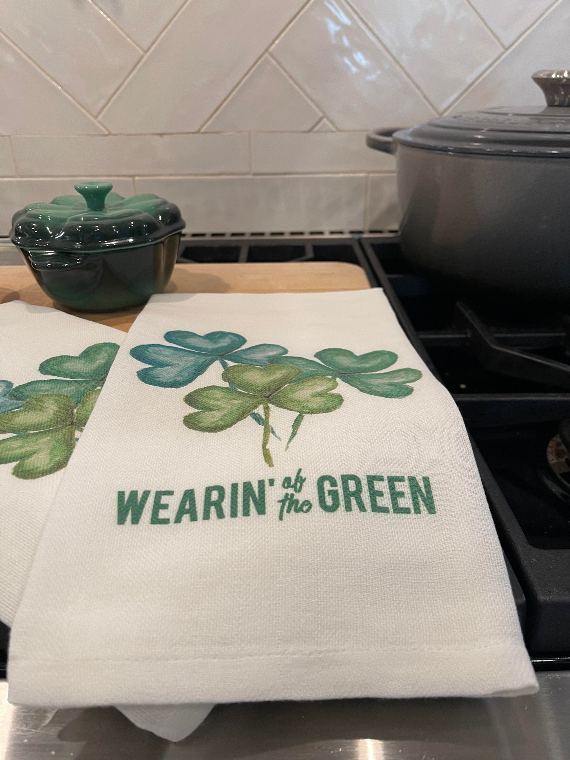 Three Shamrocks kitchen towel with Wearin' of the Green wording.